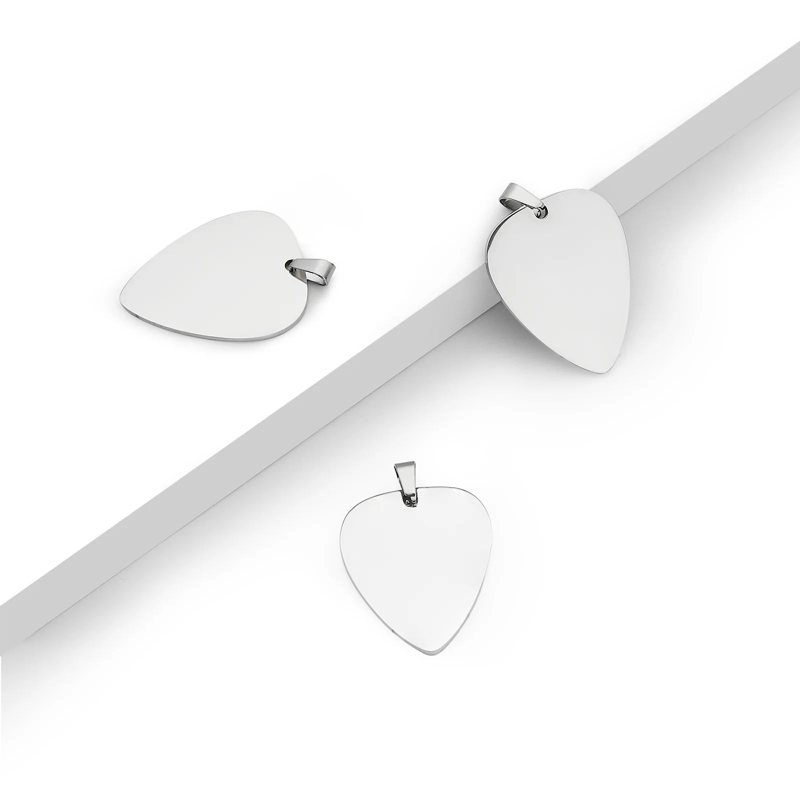 Engraved stainless steel guitar pick pendant