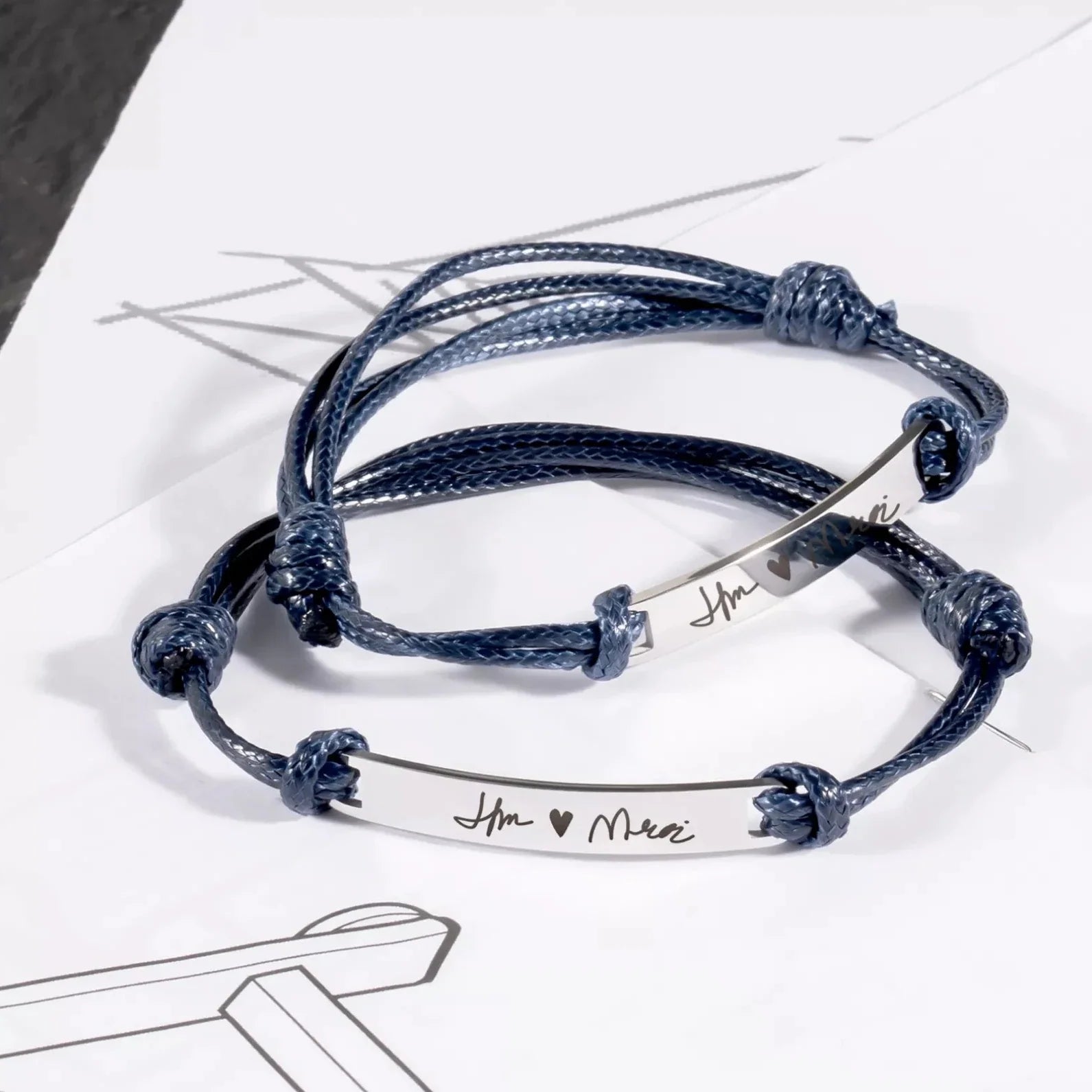 Cord bracelet with engravable tag