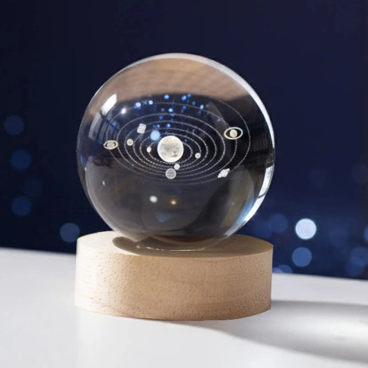Crystal sphere with 3D engraved solar system on a wooden LED base