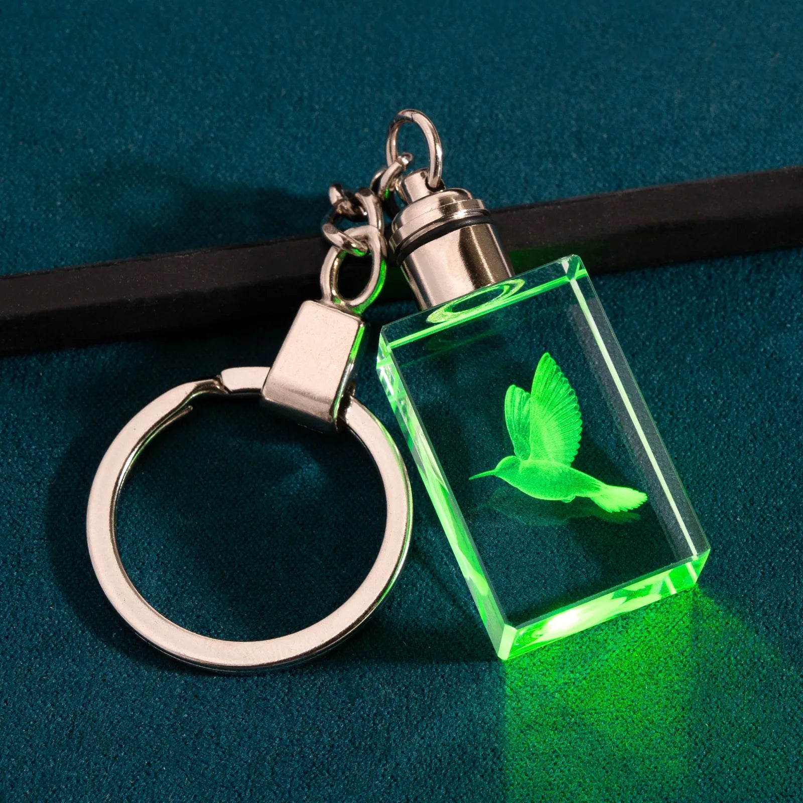 Rectangle crystal keychain with laser-engraved hummingbird lit in green